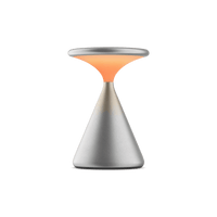 Salt von GRAU ist eine elegante Tischleuchte aus Metall mit konischem Sockel und warmem, dimmbarem LED-Lichtdesign.