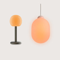 Fire Table & Sun Bundle von GRAU mit mundgeblasenem Glas, Aluminium und dimmbaren, warmen LED-Designleuchten.