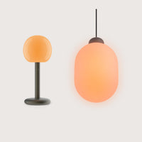 Fire Table & Sun Bundle von GRAU mit mundgeblasenem Glas, Aluminium, dimmbaren Lichtquellen, modernes Lichtdesign, warme Atmosphäre.